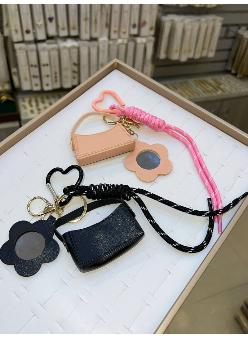 A stylish heart-shaped bag and keychains in assorted colors - Image 2